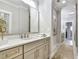 Bright bathroom featuring a large mirror, spacious countertops, and modern fixtures at 578 Brashy Street, Woodstock, GA 30188