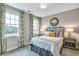 Neutral bedroom featuring decorative curtains, carpet, and natural light at 578 Brashy Street, Woodstock, GA 30188