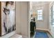 Stylish entryway featuring sleek furniture, modern artwork, and a bright window for a welcoming first impression at 578 Brashy Street, Woodstock, GA 30188
