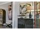Elegant entryway with a decorative cabinet, eye-catching artwork, and sophisticated décor, creating a welcoming ambiance at 578 Brashy Street, Woodstock, GA 30188