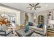 Spacious living area with elegant decor, comfortable seating, and an inviting open layout perfect for entertaining guests at 578 Brashy Street, Woodstock, GA 30188