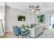 Comfortable living room featuring modern furniture, ceiling fan and wall mounted TV at 578 Brashy Street, Woodstock, GA 30188