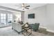 Cozy living room features modern furniture, a ceiling fan and access to outdoor balcony at 578 Brashy Street, Woodstock, GA 30188