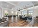 Spacious lounge area perfect for gatherings with wood floors, ceiling fans, and natural light at 578 Brashy Street, Woodstock, GA 30188