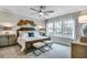 Inviting main bedroom featuring a beautiful accent wall, carpet, and natural light at 578 Brashy Street, Woodstock, GA 30188