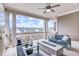 Stylish covered patio featuring comfortable seating and a modern fire pit with great neighborhood view at 578 Brashy Street, Woodstock, GA 30188