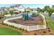 Neighborhood playground with slides and climbing structures, surrounded by a white picket fence at 578 Brashy Street, Woodstock, GA 30188