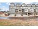 Exterior view of modern townhomes with garages and private balconies, offering a contemporary living style at 578 Brashy Street, Woodstock, GA 30188