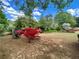 Landscaped backyard with flowering azaleas creates a vibrant and inviting outdoor space at 1453 Reagan Cir, Conyers, GA 30012