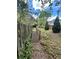 Wooden bridge detail amid lush greenery in the backyard, fenced for privacy and security at 1453 Reagan Cir, Conyers, GA 30012