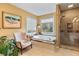 Luxurious bathroom featuring a jetted tub with tile surround and a glass-enclosed shower at 1453 Reagan Cir, Conyers, GA 30012