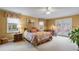 Bright bedroom with large windows, French doors, and a comfortable seating area outside at 1453 Reagan Cir, Conyers, GA 30012