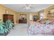 Spacious bedroom with carpeted floor, warm yellow walls, large windows, and ample natural light at 1453 Reagan Cir, Conyers, GA 30012