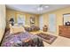 Bedroom featuring carpeted floors, yellow walls, and two twin beds at 1453 Reagan Cir, Conyers, GA 30012