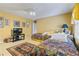 Bedroom featuring carpeted floors, yellow walls, and two twin beds at 1453 Reagan Cir, Conyers, GA 30012