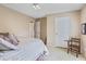 Bedroom with a plush queen sized bed, light colored walls, and light colored carpet at 1453 Reagan Cir, Conyers, GA 30012