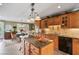 Kitchen island with granite countertop, breakfast bar, and stainless steel appliances at 1453 Reagan Cir, Conyers, GA 30012