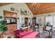 Living room with wood ceiling, chandelier, hardwood floors and an attached wet bar at 1453 Reagan Cir, Conyers, GA 30012