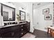 Bathroom with double sinks, and elegant black and white color scheme at 2080 Silversmith Ln, Stone Mountain, GA 30087