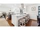 Bright kitchen features a large center island with seating and modern stainless steel appliances at 2080 Silversmith Ln, Stone Mountain, GA 30087