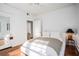 Bright bedroom with hardwood floors and neutral decor, complemented by ample natural light at 3 Park Ne Ln # H, Atlanta, GA 30309