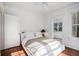Bright bedroom features hardwood floors, neutral walls, and large windows for ample sunlight at 3 Park Ne Ln # H, Atlanta, GA 30309