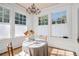 Charming dining area with natural light, chandelier, and table at 3 Park Ne Ln # H, Atlanta, GA 30309