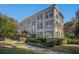 Charming exterior view of a multi-story condo building with manicured landscaping and inviting curb appeal at 3 Park Ne Ln # H, Atlanta, GA 30309