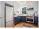 Modern kitchen featuring stainless steel appliances, two-tone cabinets, and hardwood floors at 3 Park Ne Ln # H, Atlanta, GA 30309