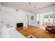Sun-lit living room offering a view into the dining room with hardwood floors and neutral walls at 3 Park Ne Ln # H, Atlanta, GA 30309