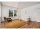 Inviting living room with hardwood floors, natural light, and neutral paint, ideal for relaxation and entertaining at 3 Park Ne Ln # H, Atlanta, GA 30309