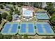 An aerial view of the community amenities showcasing a pool, playground, and tennis courts for residents' recreation and enjoyment at 3835 Greenside Ct, Dacula, GA 30019