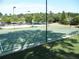 An outdoor basketball court with green surface, white lines, and benches, perfect for recreational activities and community fun at 3835 Greenside Ct, Dacula, GA 30019