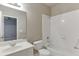 Bathroom with combination tub and shower at 3835 Greenside Ct, Dacula, GA 30019