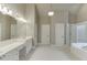Bright bathroom with double sinks, tub, shower, and plenty of cabinet space at 3835 Greenside Ct, Dacula, GA 30019