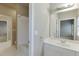 Bright bathroom featuring a shower-tub combo, white vanity with chrome fixtures, and tiled floors at 3835 Greenside Ct, Dacula, GA 30019