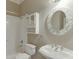 Bathroom featuring a floral vanity mirror, and tiled shower-tub combination at 3835 Greenside Ct, Dacula, GA 30019