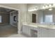 Bathroom with double sinks and vanity, soaking tub reflected in the large mirror at 3835 Greenside Ct, Dacula, GA 30019