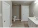 Spacious bathroom with tile floor, toilet, vanity and sink at 3835 Greenside Ct, Dacula, GA 30019