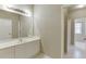 Bathroom with white vanity, sink, mirror, and combination tub/shower at 3835 Greenside Ct, Dacula, GA 30019