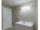 Bathroom features a modern vanity with white cabinets and chrome fixtures, complemented by bright lighting at 3835 Greenside Ct, Dacula, GA 30019