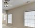 Bedroom with two windows offering natural light and a ceiling fan at 3835 Greenside Ct, Dacula, GA 30019