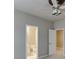 Neutral bedroom featuring a ceiling fan and ensuite bathroom, offering comfort and convenience at 3835 Greenside Ct, Dacula, GA 30019