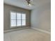Spacious bedroom with plush carpet and large window allowing plenty of natural light at 3835 Greenside Ct, Dacula, GA 30019