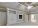 Spacious primary bedroom features tray ceiling, ceiling fan, built-ins and fireplace at 3835 Greenside Ct, Dacula, GA 30019