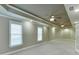 Large bonus room featuring dual ceiling fans and recessed lighting, perfect for entertaining at 3835 Greenside Ct, Dacula, GA 30019