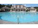Large community pool surrounded by lounge chairs for relaxation and sunbathing at 3835 Greenside Ct, Dacula, GA 30019