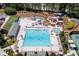 A large community pool with water slides, lounge chairs, and umbrellas, providing a perfect summer getaway for residents and families at 3835 Greenside Ct, Dacula, GA 30019