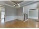 Open dining area with hardwood floors, wainscoting, and access to additional living spaces at 3835 Greenside Ct, Dacula, GA 30019