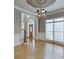 Elegant dining room featuring hardwood floors and a decorative chandelier fixture at 3835 Greenside Ct, Dacula, GA 30019